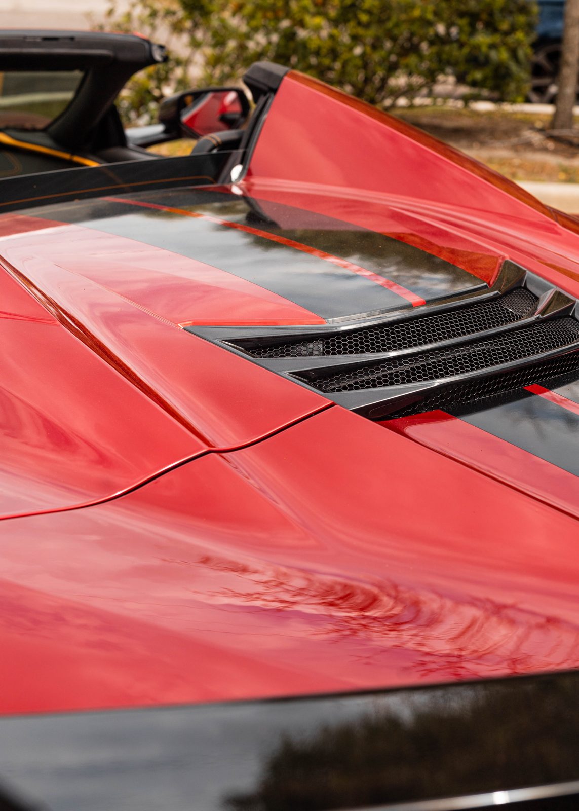 Red C8 Corvette showing deep, defect-free gloss after machine paint correction in Durham