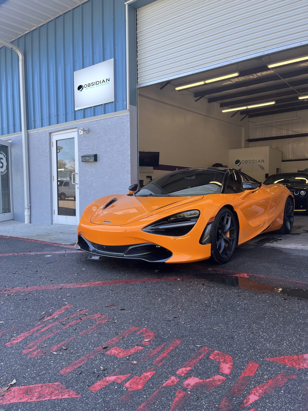 Paint correction and detailing on an orange McLaren supercar in Chapel Hill, NC